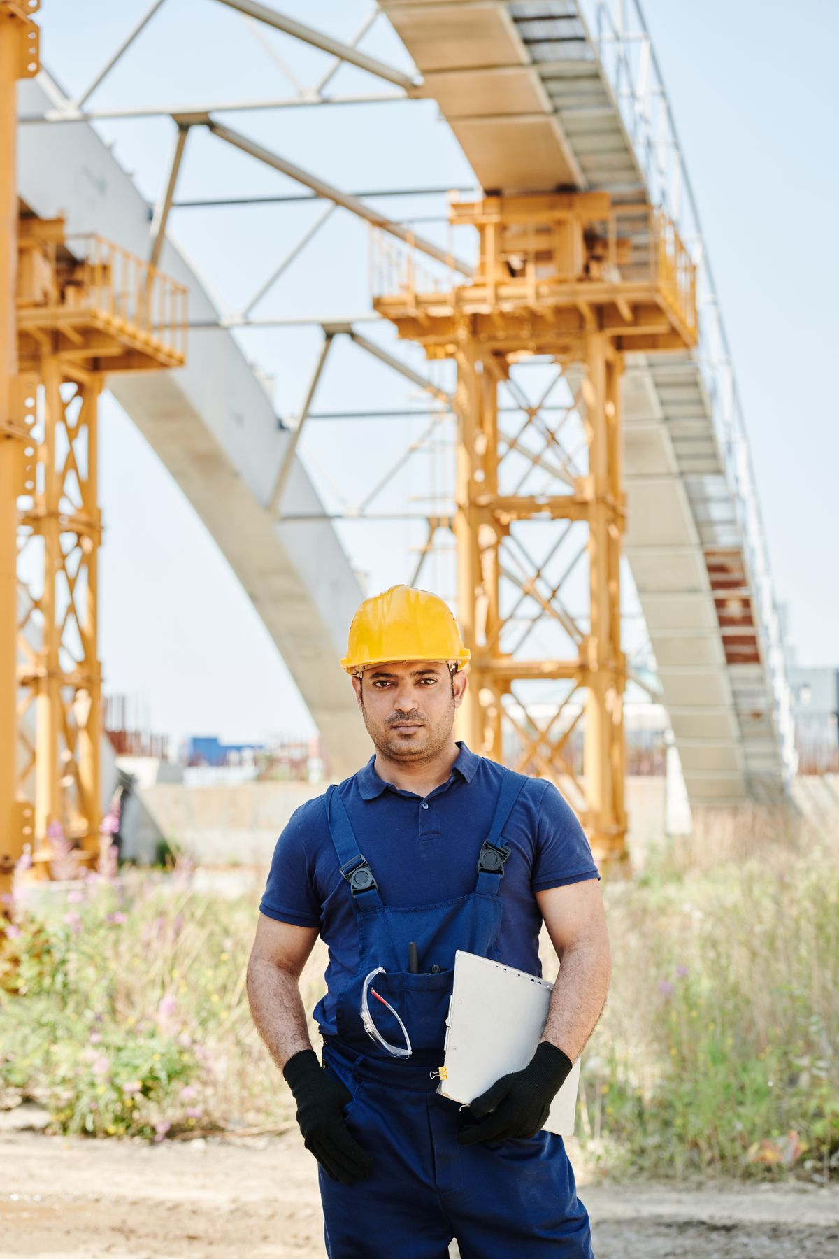 Site inspector documenting findings at a construction project