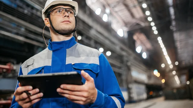 Field technician inspecting HVAC equipment